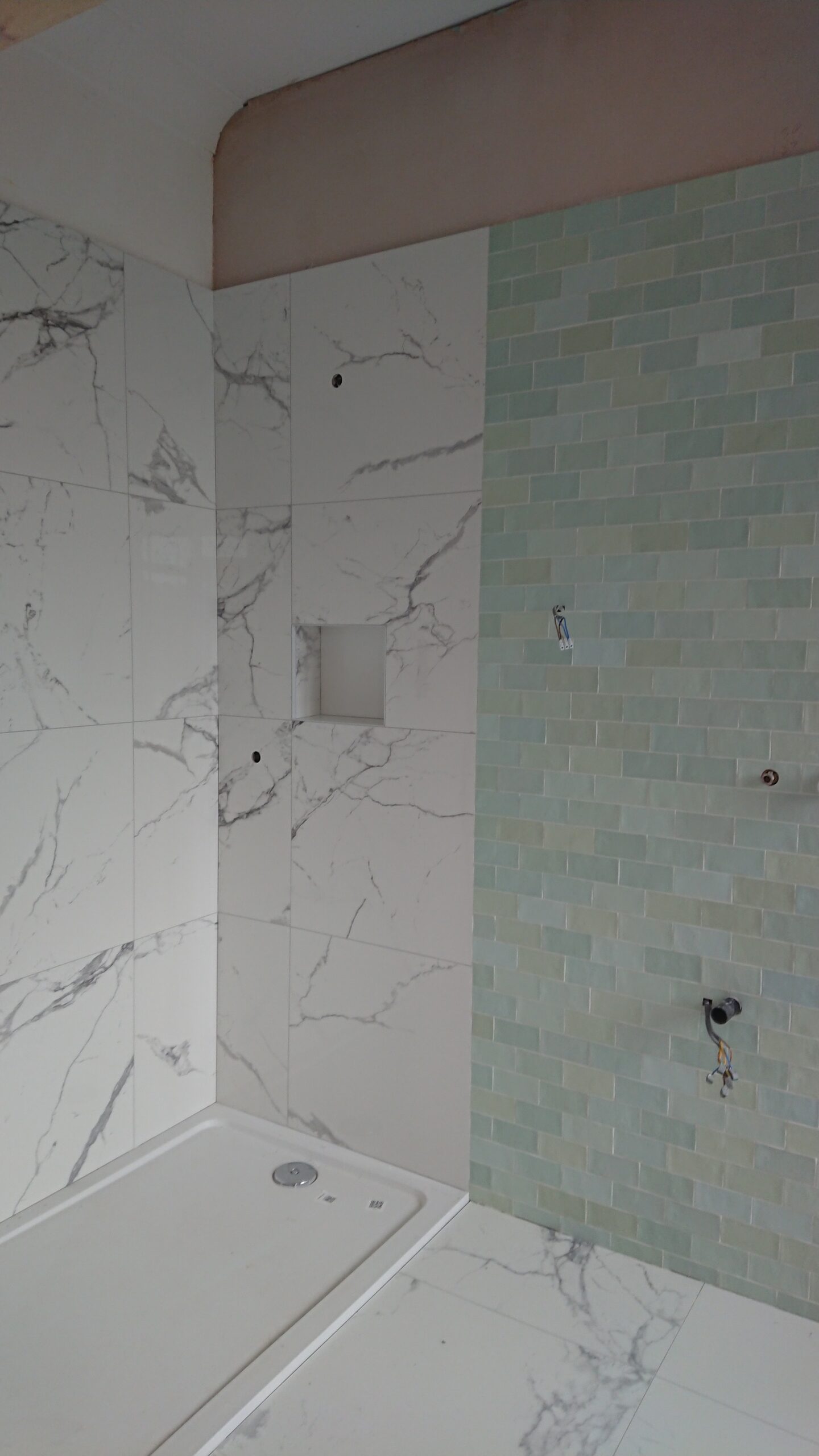 Herringbone shower tiling