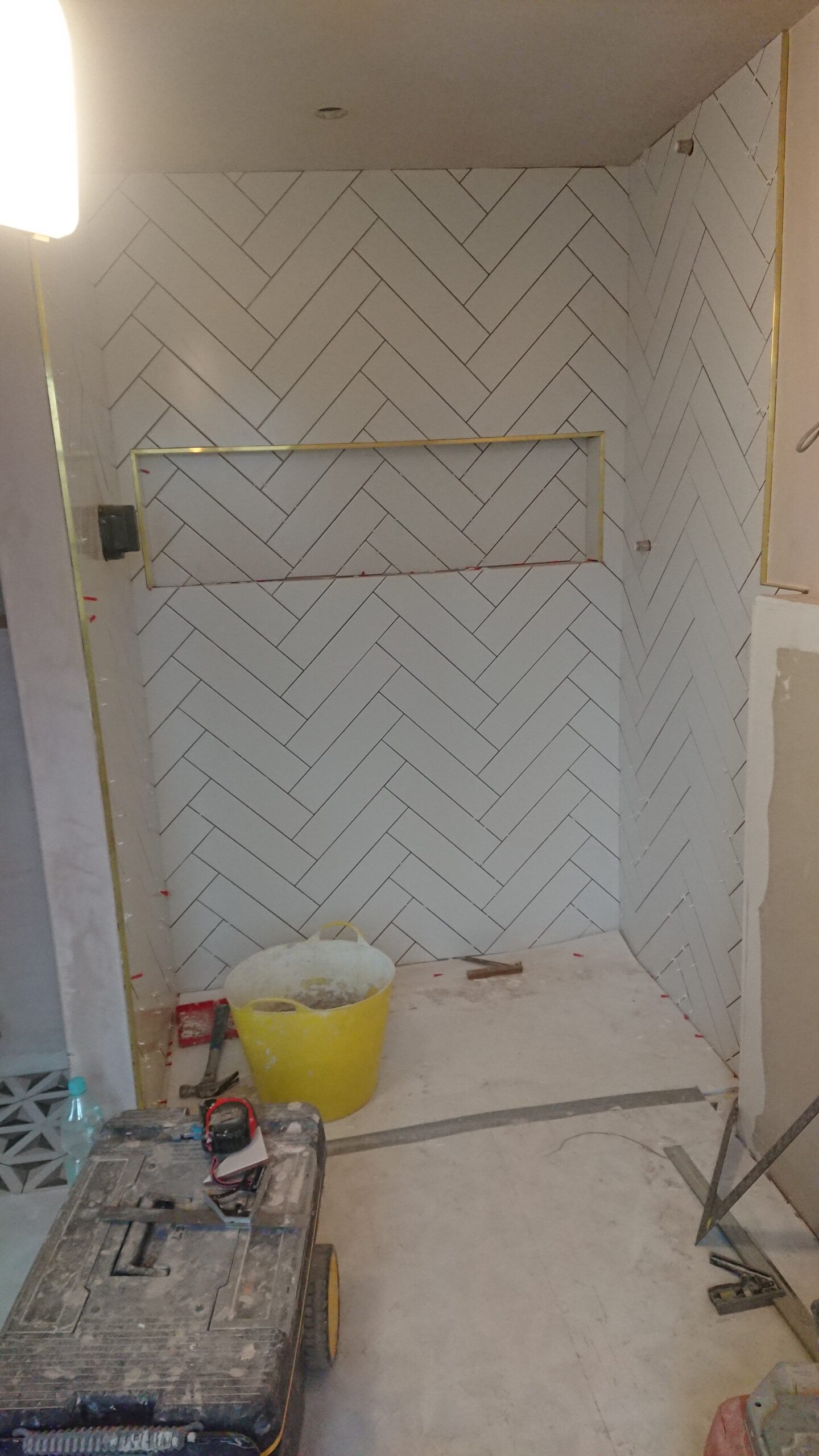 Herringbone shower tiling